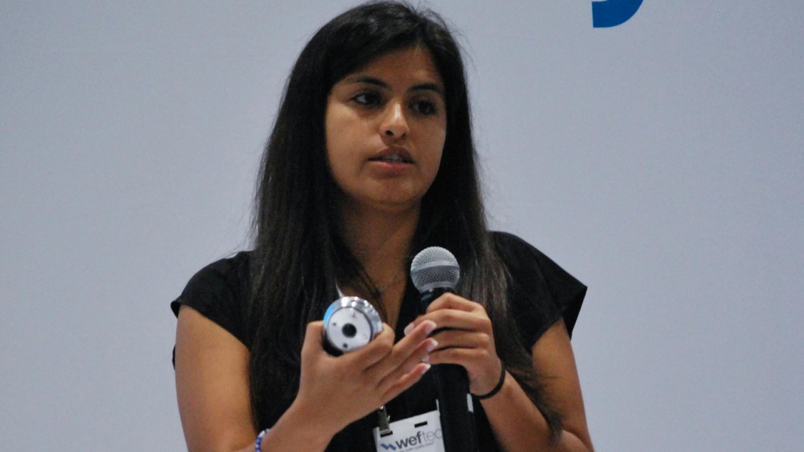 Bianca Pinto, biological systems engineer for the Water Environment Federation, speaks during an Innovation Theater presentation Tuesday at WEFTEC 2024 in New Orleans.