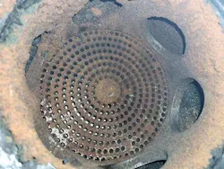 A typical compressor valve with fouling. A typical compressor valve with fouling.