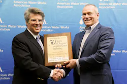 AWWA CEO David LaFrance (left) congratulates Randy Moore, Director of Sales-Agency Development and Industry Affairs and Vice President of the AWWA Board of Directors. AWWA CEO David LaFrance (left) congratulates Randy Moore, Director of Sales-Agency Development and Industry Affairs and Vice President of the AWWA Board of Directors.