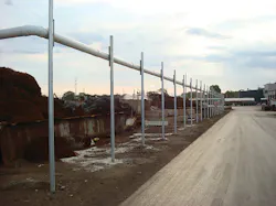 An odor curtain with an elevated header prevents odors from escaping. An odor curtain with an elevated header prevents odors from escaping.