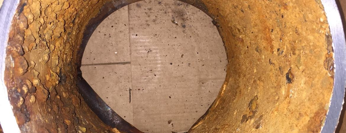 The rusted interior of this water pipe contains chromium that reacts with residual water disinfectants to form carcinogenic hexavalent chromium.