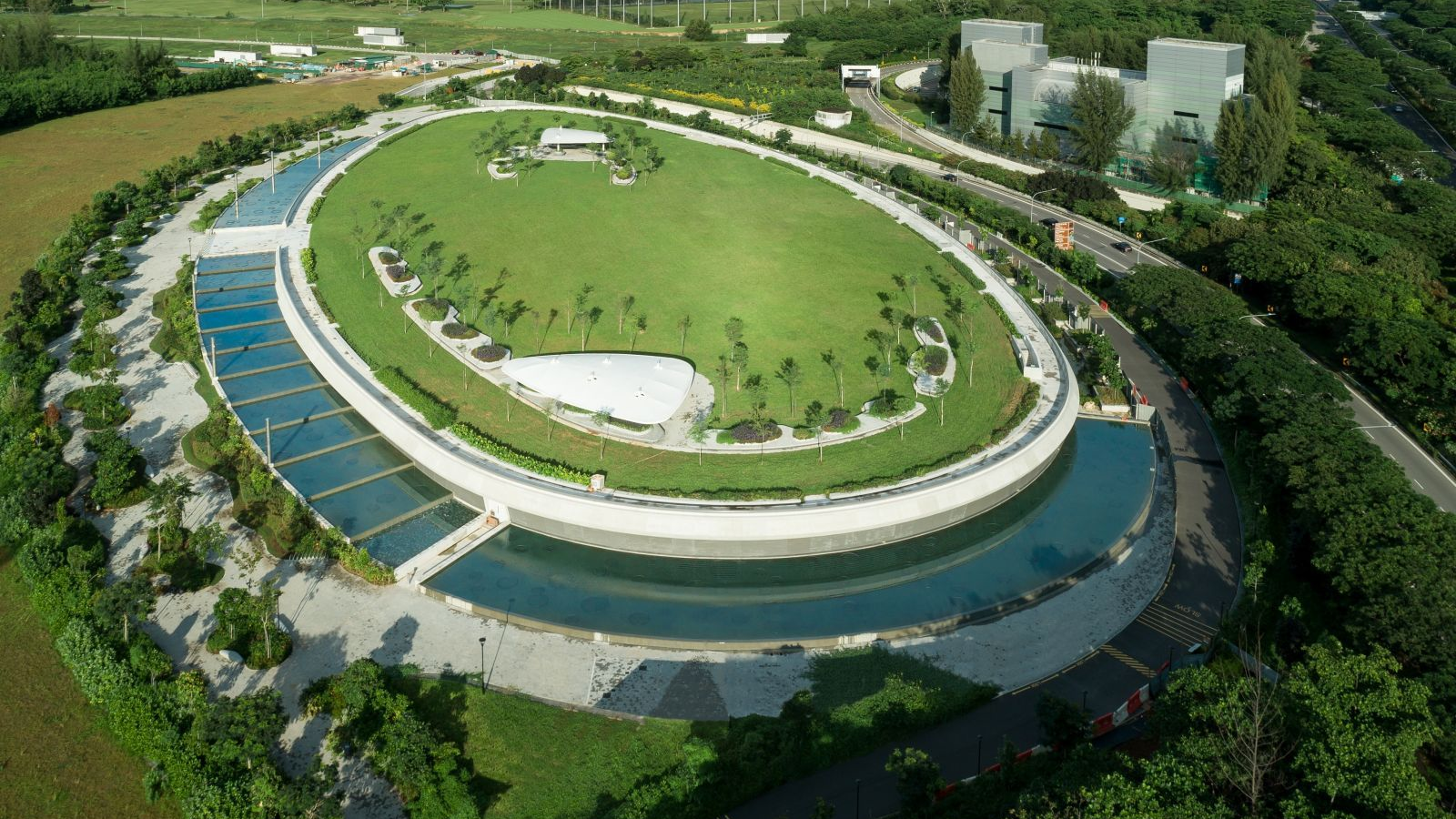 The Keppel Marina East Desalination Plant's innovative design integrates the plant with surrounding greenery by situating the treatment equipment underground.