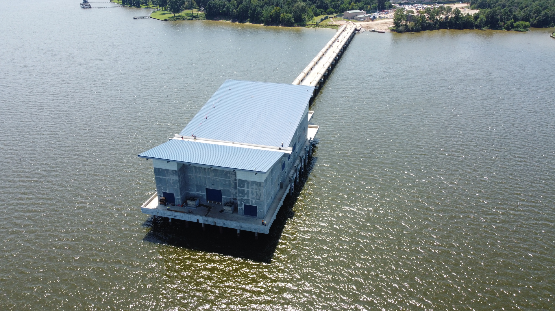 The new Intake Pump Station, built 1,000 feet from the shore in Lake Houston, will withdraw raw water from the lake and pump it to a newly constructed plant 1.5 miles away for treatment.