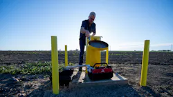 A DWR engineering geologist measures groundwater levels at designated monitoring wells in Yolo County. A DWR engineering geologist measures groundwater levels at designated monitoring wells in Yolo County.