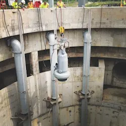 One_of_nine_Flygt_pumps_being_lowered_into_position_in_deep_well_copy One_of_nine_Flygt_pumps_being_lowered_into_position_in_deep_well_copy