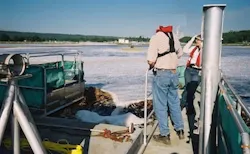 water-sampling-lagoon-barge-maintenance-pulp-mill water-sampling-lagoon-barge-maintenance-pulp-mill