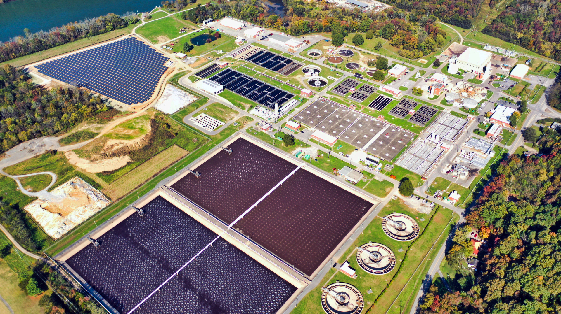 The 10-acre solar farm (top left) installed in 2020 provides around 12% of the plant&rsquo;s energy needs, which significantly impacts the aeration energy expenditure of its equalization basin.
