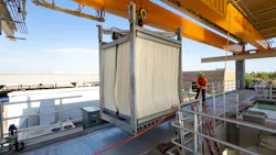 A worker guides a Veolia Zeeweed uiltrafiltration membrane cell into place for installation in Arizona. A worker guides a Veolia Zeeweed uiltrafiltration membrane cell into place for installation in Arizona.