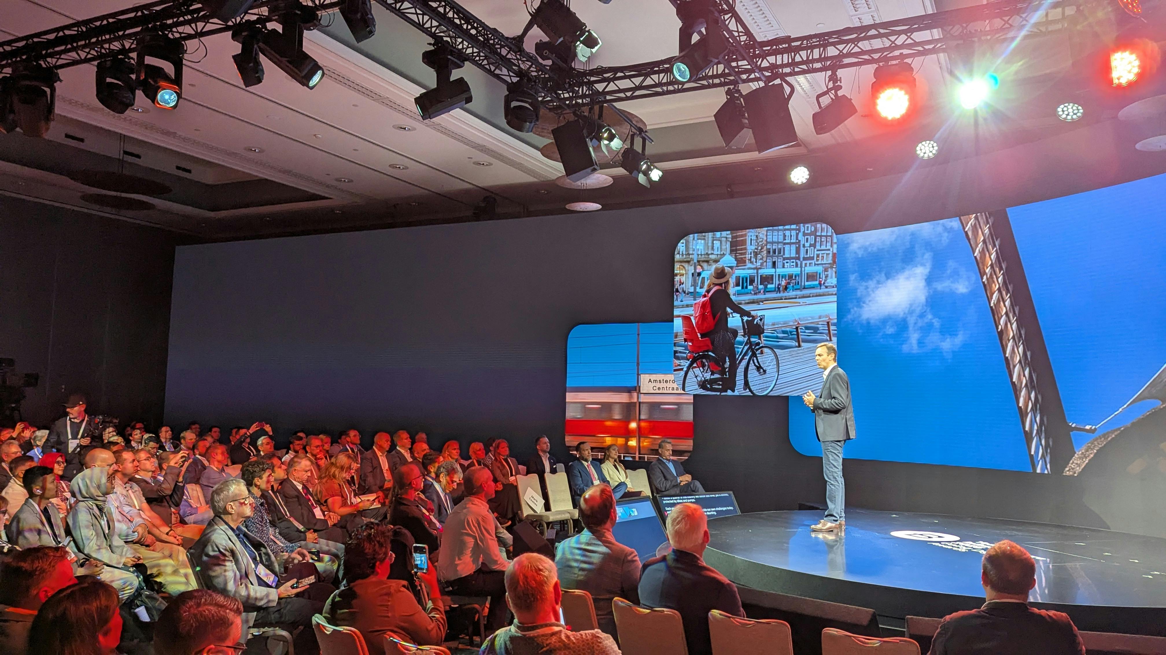 Bentley Systems CEO Nicholas Cumins speaks to a crowd of International press.